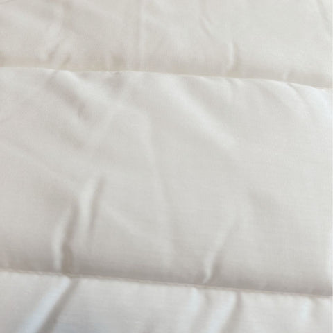 A close up image of a Final Sale: Encompass Group Double Fill Mattress Pad, providing comfort and support.