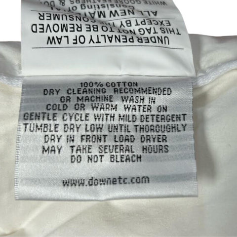A label on a white piece of clothing with Down Etc. Rhapsody Wrap Down/Feather Pillow- Featured at Many Hyatt® Hotels filling.