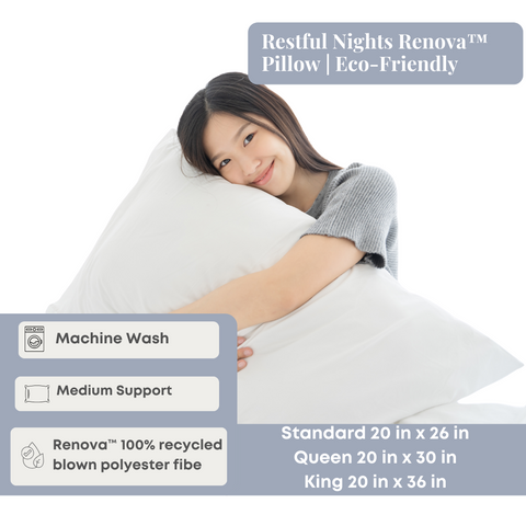 A contented woman rests her head on the Restful Nights Renova™ Pillow, which boasts eco-friendly credentials such as machine washability, medium support, and being made from 100% Renova® Rec.