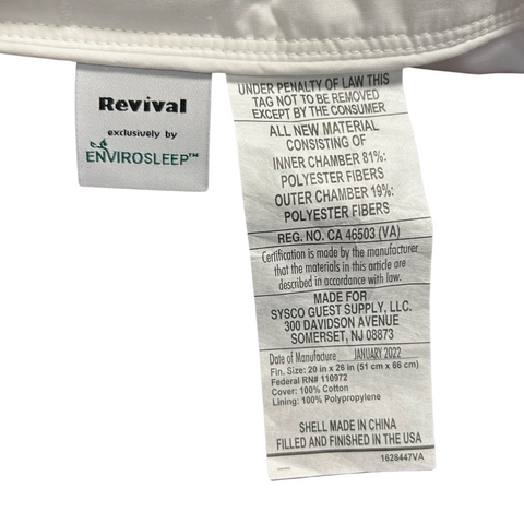 A Revival Cluster and Micro Gel Fiber Pillow from Sysco Guest Supply, LLC. with text providing legal disclaimers, material information stating 100% polyester cluster fibers, manufacturer details (Sysco Guest Supply, LLC.), manufacturing date (January 2022), dimensions