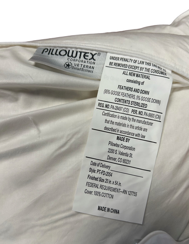 A close-up of a white Pillowtex® body pillow cover tag showing material composition, which includes 95% goose feathers and 5% goose down for luxurious comfort, care instructions, certification details.