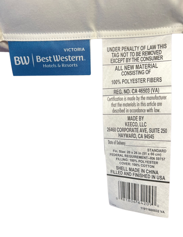 A label from a Best Western® Victoria Pillow indicating 100% polyester fiberfill content for a hypoallergenic pillow, with care instructions, manufacturing details, including that it's made by Keeco LLC