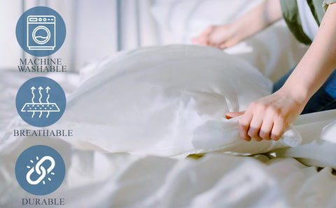 A person's hands smoothing out a white, breathable Pillowtex Waterproof Pillow Protector with a Nylon Zipper, that is machine washable and durable, as indicated by the icons on the left.