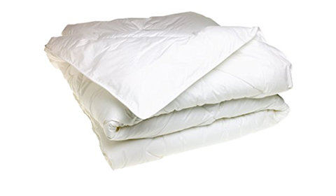 A stack of Natural Living INGEO™ Mattress Toppers on a white background.