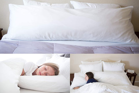 A woman is sleeping in a bed with a Pillowtex Premium Polyester Body Pillow for support and comfort.