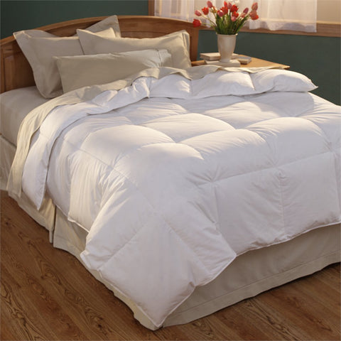 A Spring Air Down Alternative Comforter Luxury Loft with all-season warmth on a wooden floor.