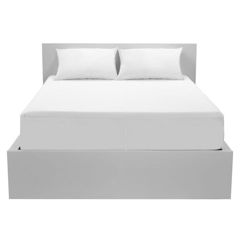 A white bed with Protect-A-Bed Basic Waterproof Mattress Protector on the mattress.