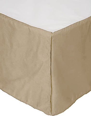 A neatly draped Pillowtex bed skirt fits cleanly around the corner of a white mattress, adding a tailored look to the bed's base, concealing the space underneath, and elegantly covering box spring covers.
