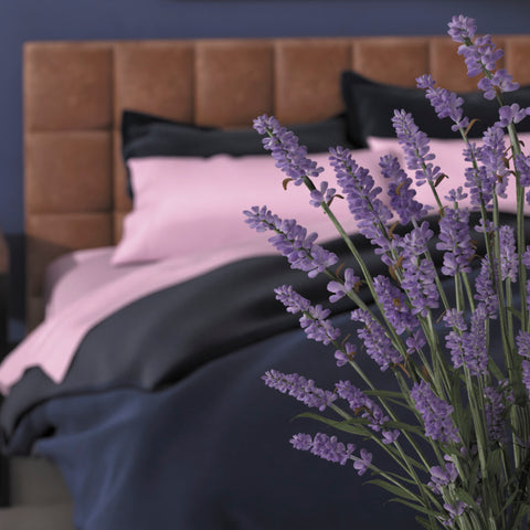 A PureCare Aromatherapy Total Encasement Mattress Protector with lavender flowers for total encasement and aromatherapy benefits.
