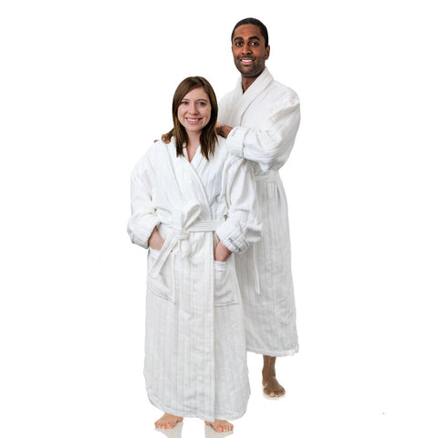 A man and woman posing for a photo in a white bathrobe by Pillowtex Hotel Robe | 100% Combed Cotton Velour Bathrobe.