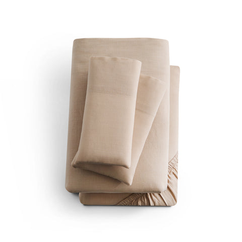 A Malouf Linen-Weave Cotton Sheet Set on a white surface.