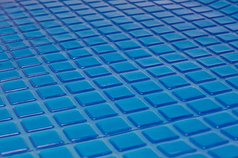 A close up image of an Opulence Glacier Blanket in blue tiles suitable for adult use.