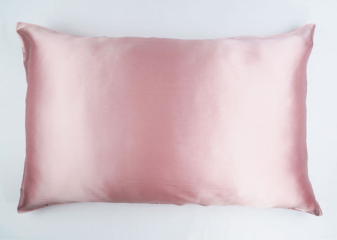 A 100% Mulberry Silk Pillowcase | Zipper Enclosure, 16 Momme in pink satin on a white background, ideal for skin care by Pillowtex.