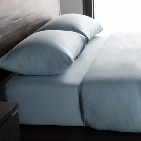 A bed with a luxurious feel from the Malouf Portuguese Flannel Sheet Set.