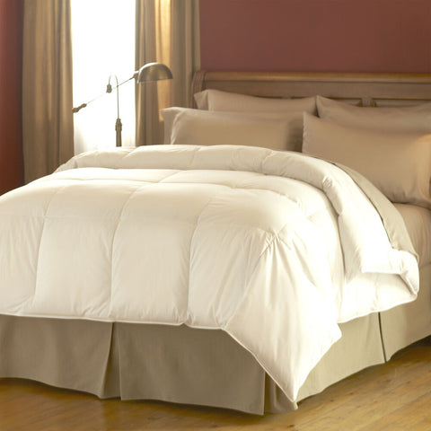 A white comforter on the bed is made of Final Sale: Natural Living Ingeo Comforter | Environmentally Friendly Natural Fibers.