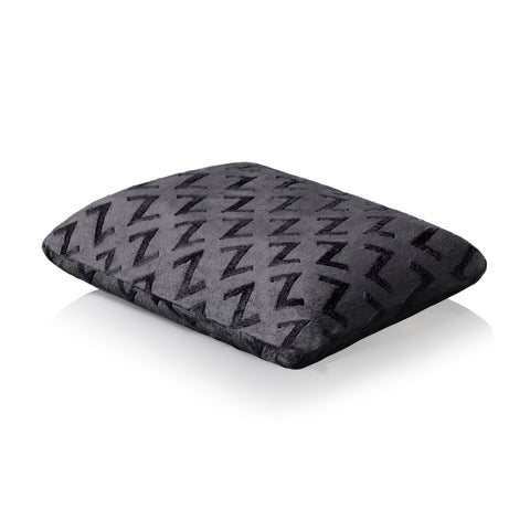 A Malouf Travel Pillow with a geometric pattern on it that's perfect for travel and providing comfort.