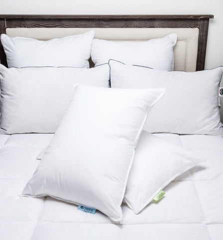 A Keeco hotel bed with Choice Hotels® Soft and Firm Polyester Pillow Combo Pack (Includes 2 Pillows) on top.