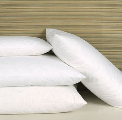 Four luxurious Cloud Nine Comforts 90/10 White Goose Feather & Down Pillows stacked on top of each other.