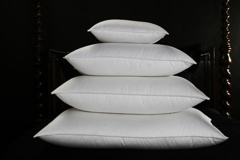 Stacked four Cloud Nine Comforts Supernova Hungarian White Goose Down Pillows, offering cloud nine comfort and luxury.