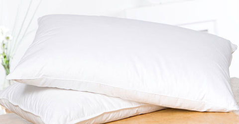 Two Creative Bedding Fossfill Pillows stacked on top of each other, featuring antibacterial FossGuard™ protection for hospitality settings.