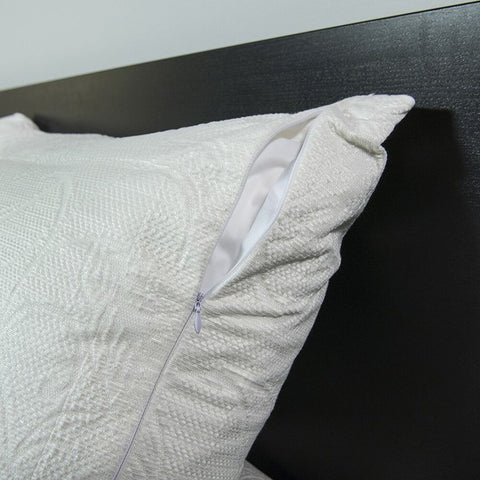 A white pillow with a Protect-A-Bed Crystal Cooling Pillow Protector With Tencel.