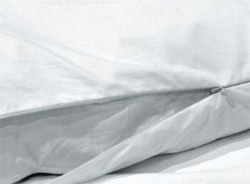 A white pillow with a Down Etc. Duvet Protector, zippered and machine washable.