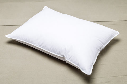 An eco-friendly Envirosleep Resiloft Soft Pillow by Manchester Mills rests on a white surface.