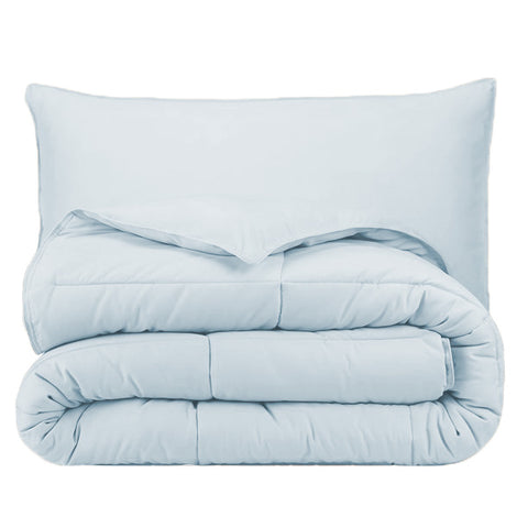 A light blue hypoallergenic Pillowtex Essential Bedding Package | All Season Comforter with Matching Pillows on a white background.