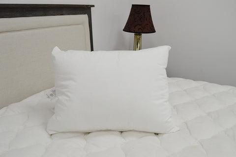 A JS Fiber "Ultra Down" 33oz. Soft Pillow | Standard Size providing comfort on the bed.