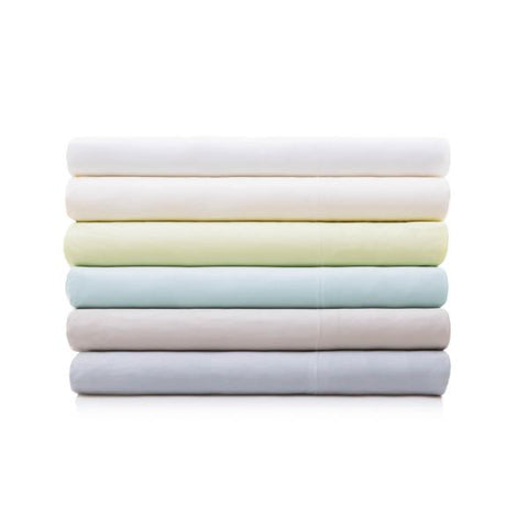A stack of Malouf Bamboo Sheet Sets on a white background.