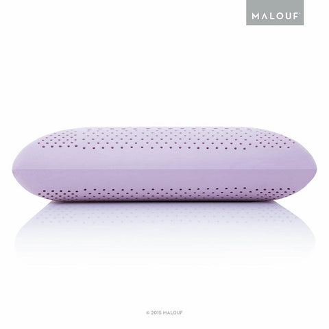 A Malouf Zoned Dough Lavender Pillow with holes filled with lavender oil for aromatherapy benefits.