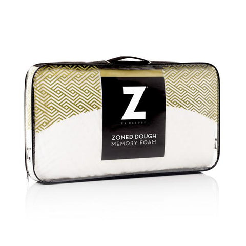 The Malouf Zoned Dough Memory Foam Pillow is packaged in a bag with a sleek gold zipper.
