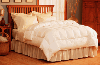 A Pacific Coast Feather Company comforter providing light warmth adorns the bed.