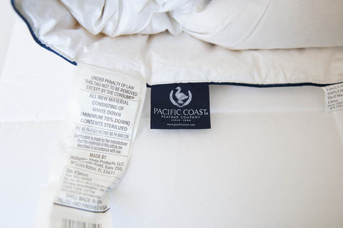 A white pillow with a Pacific Coast Feather Company label.