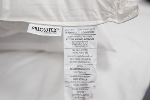 A Pillowtex 50% White Duck Feather/50% Microfiber Pillow, featuring a label.
