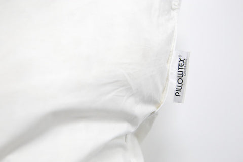 A close up of a Pillowtex Cotton Pillow Protector with a label on it.