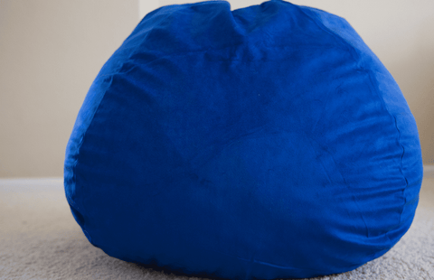 A Pillowtex Quality Kids Memory Foam Bean Bag sitting on the floor.
