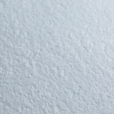 A close up image of a white surface, perfect for a Protect-A-Bed Premium Mattress Protector.