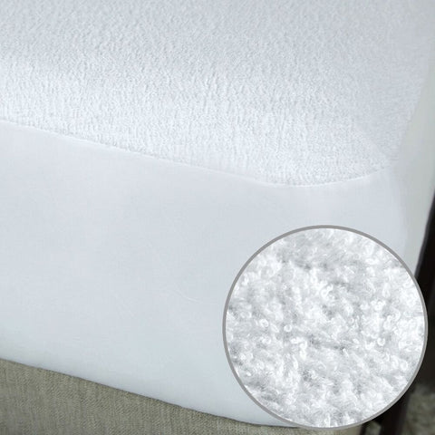A Protect-A-Bed Premium Mattress Protector with a white circle on it.