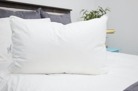 A Holiday Inn® Soft Support Pillow by Hollander on the bed.