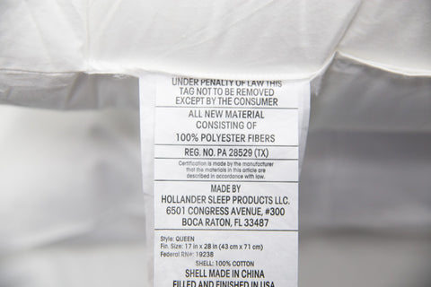 A close up of a label on a Keeco Holiday Inn® Infinity Pillow | Extra-Firm Support.