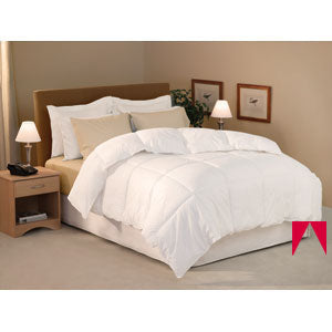 A hypoallergenic Restful Nights Royal Loft Polyester Comforter | All Season made of cotton on a bed.