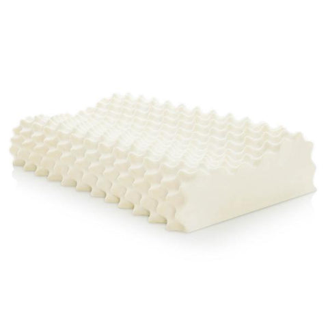 A Malouf Convoluted Contour Latex pillow providing support on a white surface.
