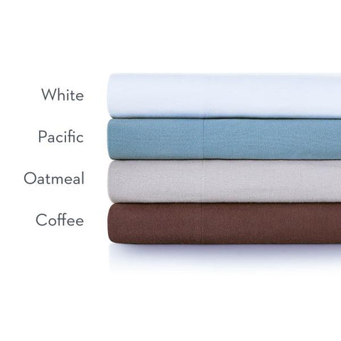 A stack of Malouf Portuguese Flannel Sheet Sets in white, brown, and blue on a white background.