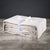 The Delilah Home Final Sale: Organic Hemp Bed Sheet Collection, showcased neatly folded and tied with a logo-printed white ribbon, sits on a wooden surface against a dark gray background for a refined, elegant display.