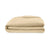A neatly folded, light beige comforter from Delilah Home’s Final Sale: Organic Hemp Bed Sheet Collection sits on a white background, showcasing its soft, smooth, and lightweight fabric with clean lines and a freshly laundered look.