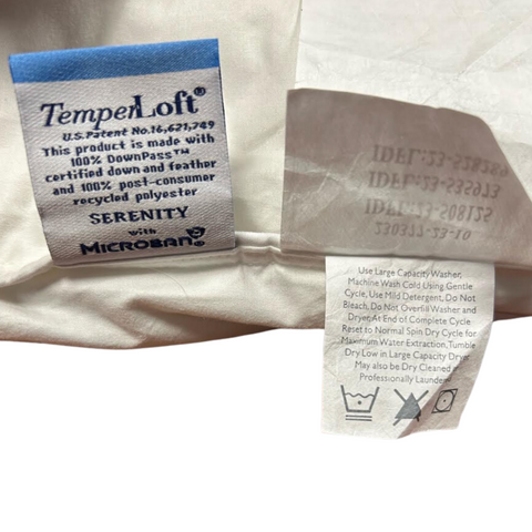 A Temperloft Down/Down Alternative Pillow with a label on it, featured at many hotels by Sysco Guest Supply.