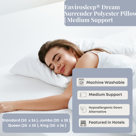 A woman is laying down in a bed with the Manchester Mills Envirosleep Dream Surrender Polyester Pillow.