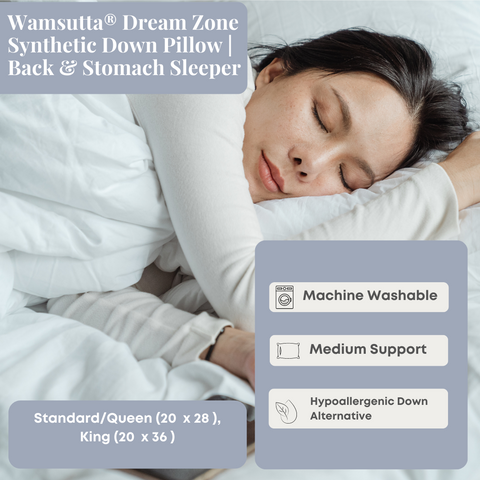 A woman is sleeping in bed with the supportive Wamsutta Dream Zone Synthetic Down Pillow by Carpenter.