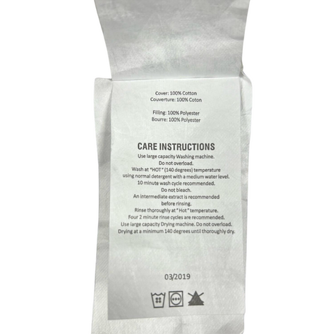 A Keeco bag with a Blue Label Firm Pillow that includes care instructions for hotels.